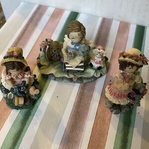 Charming Figurine Trio with Floral Accents